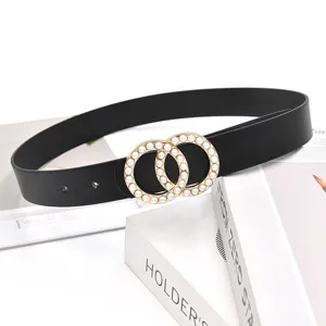 Detailed shot of a stylish black women's leather belt featuring a double pearl ring buckle.