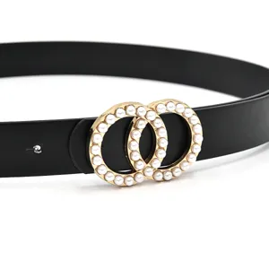 Close-up of women's black leather belt featuring an elegant double round pearl metal buckle detail.