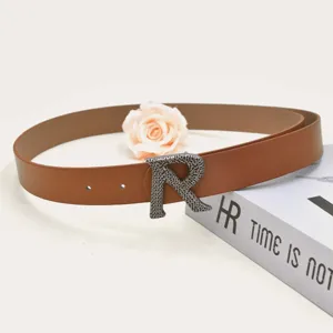 Brown PU leather women's belt featuring a unique metal R buckle for daily casual commuter wear.