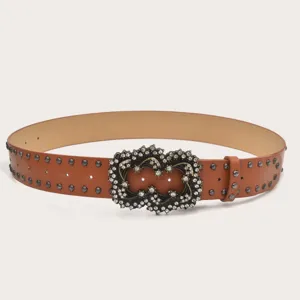 Women's brown leather belt featuring metallic studs and sparkling rhinestone buckle.