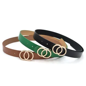 Detail shot of women leather belt featuring interlocking double pearl rings buckle fashion.
