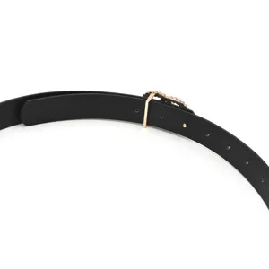 Black leather women belt with gold buckle and pearl detail for jeans and dresses detail.