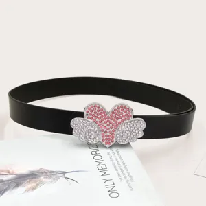 Rhinestone heart angel wings belt detail, black leather strap with sparkling pink diamonds.