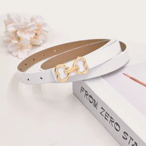 White leather belt detail with gold heart bow buckle, elegant women waist accessory.