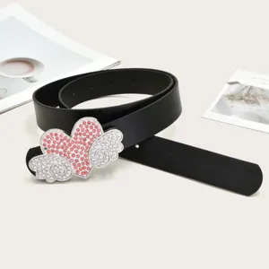 Detail view of a stylish black leather belt with rhinestone heart and wings buckle for women.