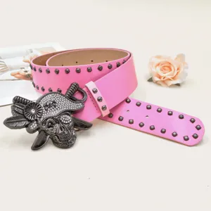 Punk Y2K pink leather belt with crystal rhinestone skull buckle and metal rivet studs for women.
