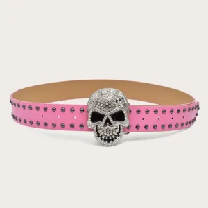 Pink studded leather belt featuring a dazzling rhinestone skull buckle for hip-hop style jeans.