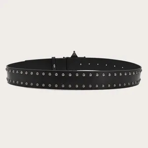 Close-up detail of black leather punk rivet belt, Y2K retro style double grommet waist accessory.