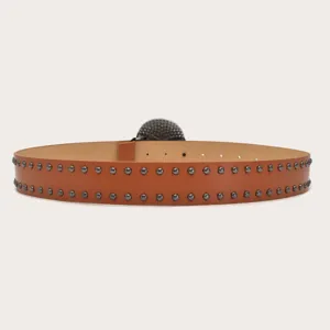 Detailed close-up view of the fashionable brown studded leather belt showcasing fine hardware.