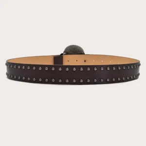 Punk style leather belt with double row metal studs and skull buckle for streetwear fashion.