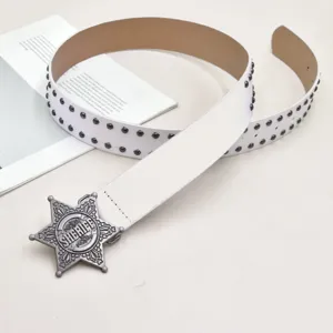 Detail view of the white Y2K retro studded leather belt featuring a vintage silver sheriff star buckle.