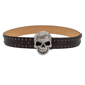 Punk style black leather belt with rhinestone encrusted skull buckle and metal studs for jeans.