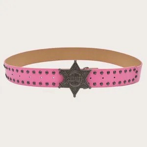 Detail view of pink y2k vintage style studded belt with cool silver metal sheriff star buckle.
