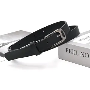 Detail shot of a minimalist black PU leather belt with metal pin buckle, chic accessory.