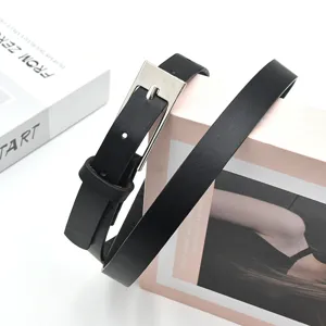 Minimalist black PU leather belt with silver pin buckle, elegant accessory for women's dresses.