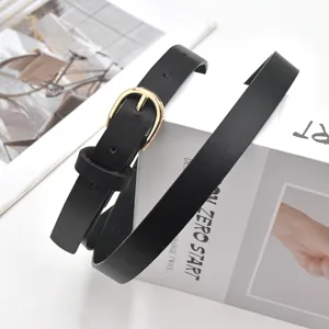 Black thin waist belt with gold buckle detail, minimalist accessory for jeans and dresses