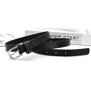 Close-up detail of black leather belt, sleek silver pin buckle, elegant minimalist design.