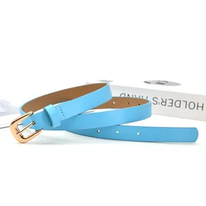 Light blue women's belt with gold pin buckle, stylish minimalist accessory detail view