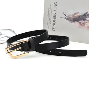 Detail shot of minimalist black leather belt with golden buckle, perfect accessory closeup view.
