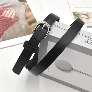 Women fashion minimalist black PU leather thin belt with silver metal pin buckle casual jeans.