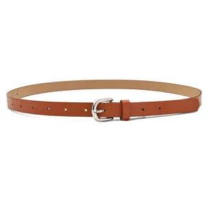 Close-up of brown PU leather belt with silver metal buckle, slim design for women jeans.