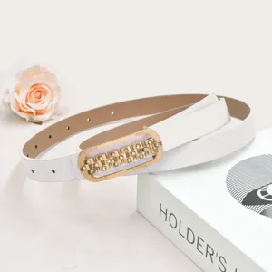 Detailed view of women white thin leather belt with gold rhinestone buckle for dress casual wear