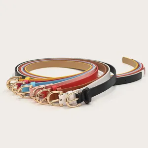 Close-up detail of stylish women's thin PU leather belts with gold buckles in multiple vibrant colors.