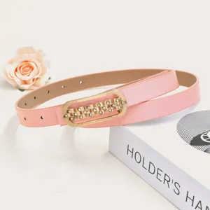 Pink women's slim leather belt with gold rhinestone buckle, versatile fashion accessory.