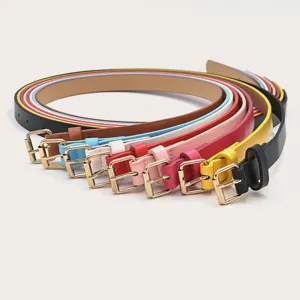 Minimalist women slim leather belt detail showing colorful belt straps and gold pin buckles.