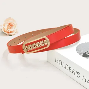 Red thin leather belt with gold rhinestone buckle, detailed shot for women dresses.