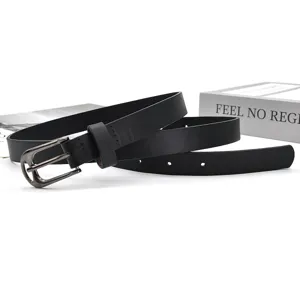 Close up detail view of black women PU leather belt featuring dark metal pin buckle.