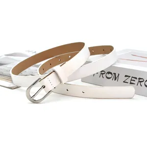 Minimalist white thin leather belt detail, classic silver metal pin buckle close-up view.