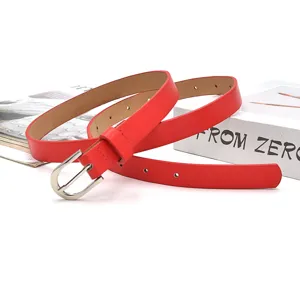 Red thin women belt with silver pin buckle minimal fashion waist strap detail view