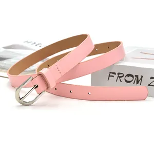 Detailed close-up view of an elegant pink leather belt featuring a classic silver pin buckle.