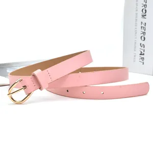 Pink leather belt with shiny gold buckle, stylish accessory for womens casual denim wear.