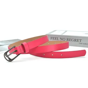 Women's slim pink PU leather belt with metal pin buckle for dresses and jeans detail view.