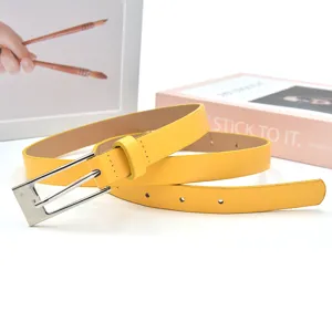 Minimalist yellow PU leather belt with silver pin buckle for women fashion trousers dresses.