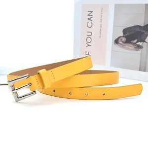 Yellow leather belt for women, minimalist stylish metal pin buckle detail for daily wear.