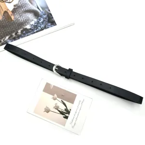 Minimalist black thin leather belt for women with silver pin buckle, elegant daily accessory.