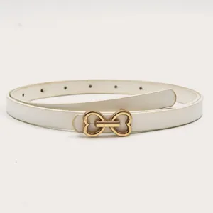 Focus on detail, white slim leather belt with gold heart metal buckle for dress jeans.