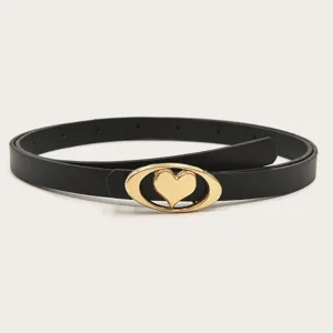 Close-up of stylish black leather belt with gold-tone oval heart metal buckle accessory.