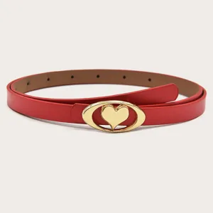 Red thin belt for women with gold oval heart buckle detail, stylish accessory for dresses.