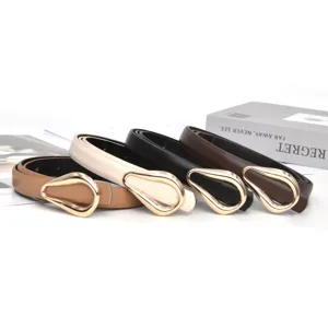 Detail view of women pu leather belt with metallic horseshoe buckle showing fine craft and texture.