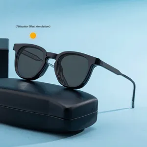 Close-up detail of trendy black square frame color-changing sunglasses with modern design.