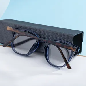 Detail view of stylish square color-changing sunglasses with blue frame and tortoise top bar.
