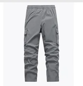 Men grey cargo pants detail view, casual multi-pocket straight trousers for daily wear.