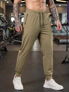 Men's quick-dry sports casual pants, elastic cuffed trousers with zipper pockets for gym.