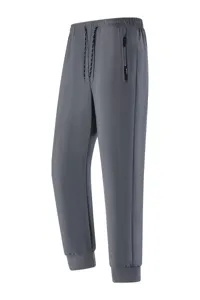Men's grey quick-drying athletic jogger pants with elastic waist, drawstring and zipper pocket.