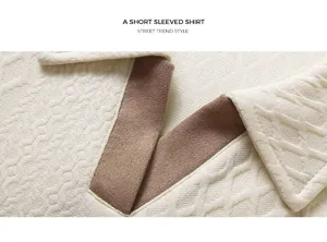 Men's casual knit short sleeve polo shirt fabric detail in beige with contrast brown collar.