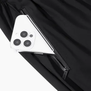 Detail view of mens quick drying athletic pants featuring secure zipper pocket for convenient storage.